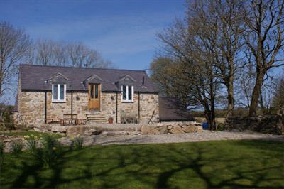 Rear of the outbuilding. First floor opens out into the gardens