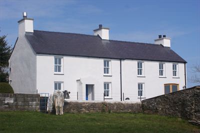 The newly lime rendered and lime washed walls of Tan Rallt