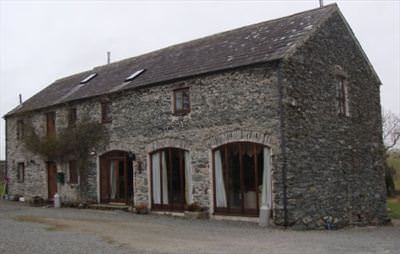 The rebuilt stone archways of the barn conversion